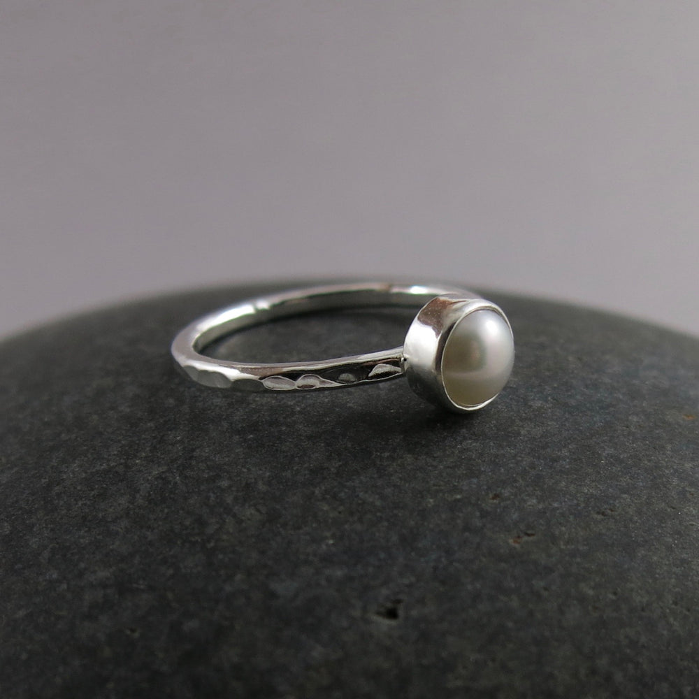 Pearl stacking ring by Mikel Grant Jewellery. White freshwater button pearl on a sterling silver band.