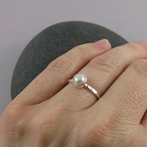 Pearl stacking ring by Mikel Grant Jewellery. White freshwater button pearl on a sterling silver band.