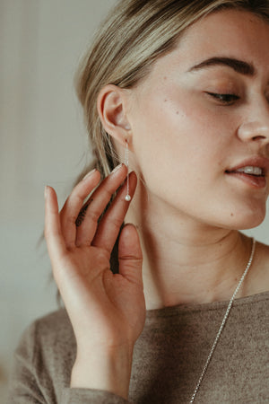 White pearl threader earrings with diamond cut cable chain by Mikel Grant Jewellery.