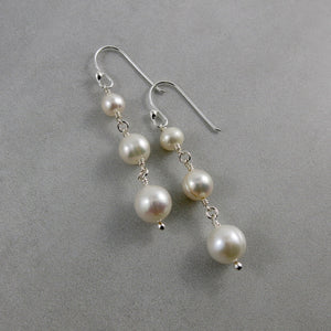 White pearl trio drop earrings in sterling silver by Mikel Grant Jewellery.