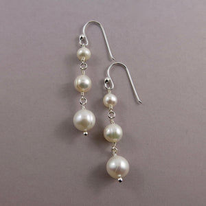 White pearl trio drop earrings in sterling silver by Mikel Grant Jewellery.