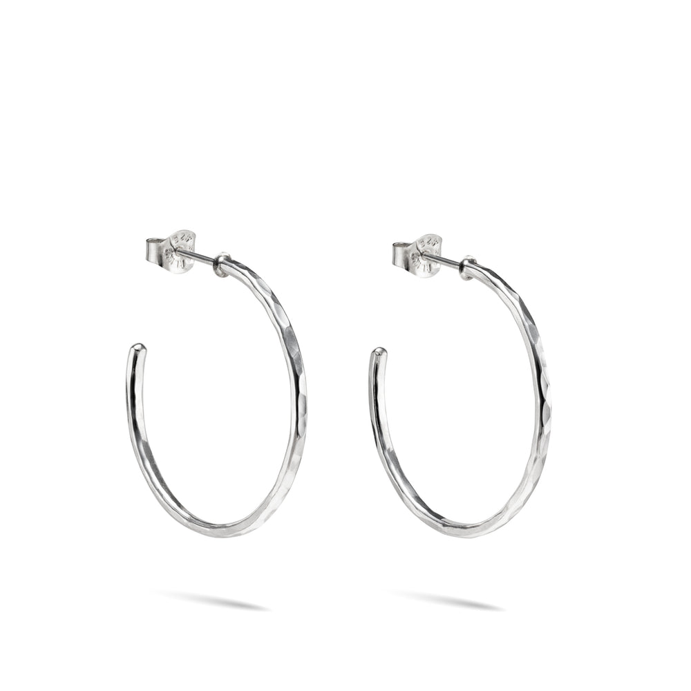 Hammer textured sterling silver open hoop stud earrings by Mikel Grant Jewellery. Artisan made on the Sunshine Coast of BC.