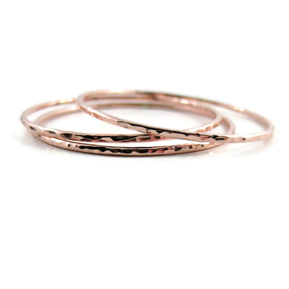 Rose gold bangle by Mikel Grant Jewellery. Artisan made hammer textured 14K rose gold filled bangle.