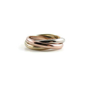 Mixed gold trinity rolling ring by Mikel Grant Jewellery. 14K yellow, rose & white gold Russian wedding ring.