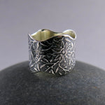 Wavy edged flower ring by Mikel Grant Jewellery.  Artisan made wide oxidized silver ring.