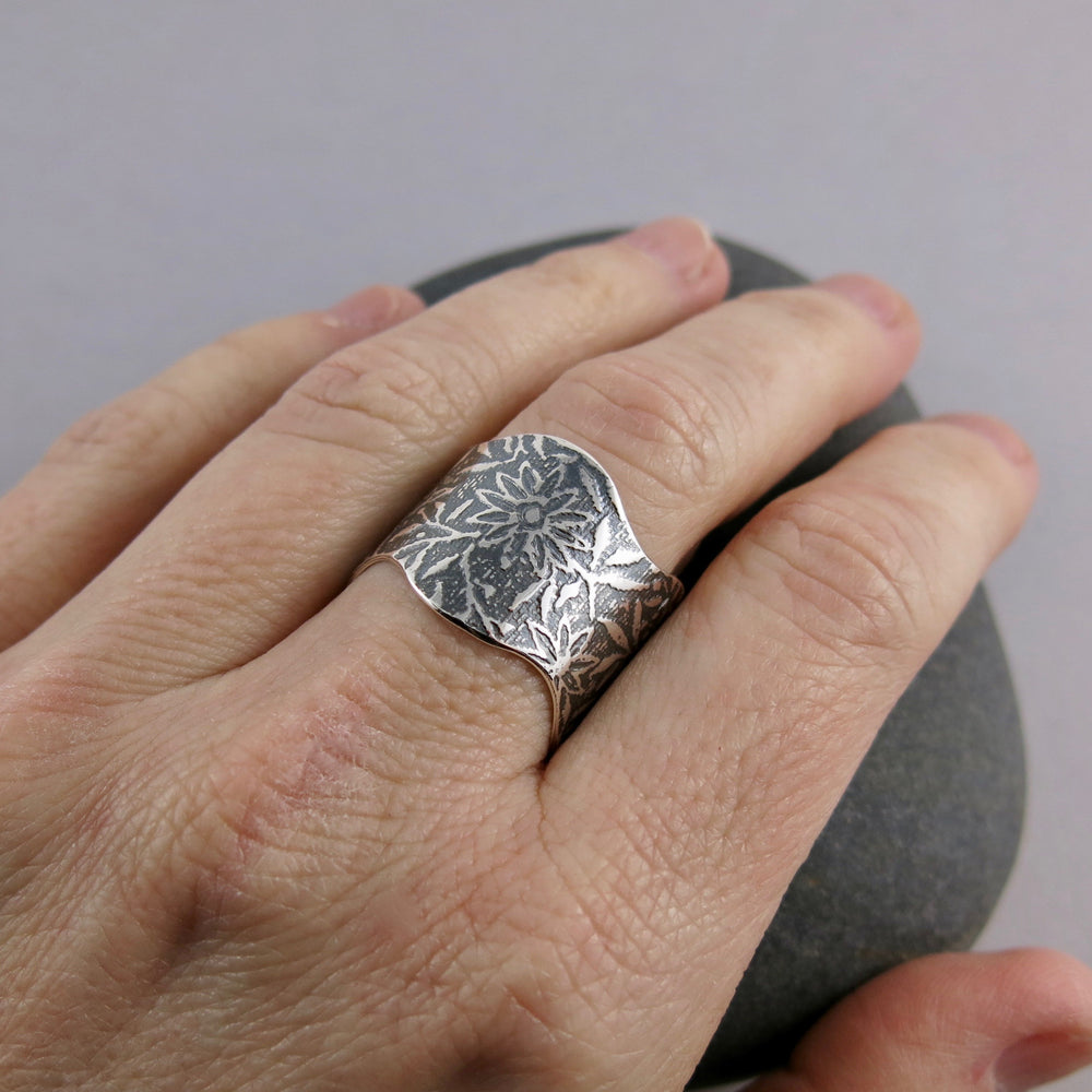 Wavy edged flower ring by Mikel Grant Jewellery. Artisan made wide oxidized silver ring.